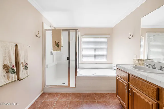 a bathroom with a sink a mirror and a bathtub