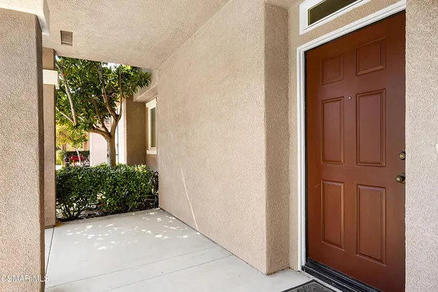 a view of a front door and a window