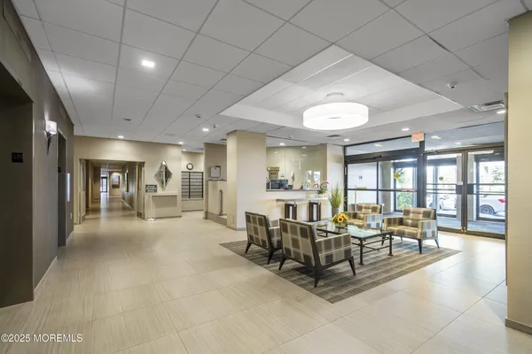 a living room with furniture and a table