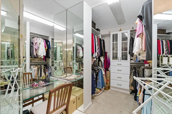 a bathroom with a double vanity sink toilet and shower