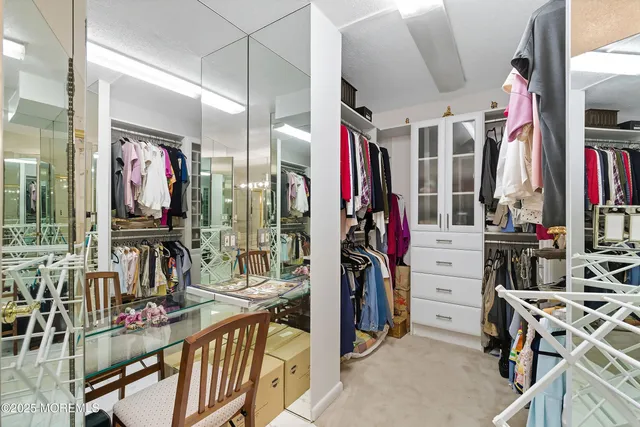 a bathroom with a double vanity sink toilet and shower