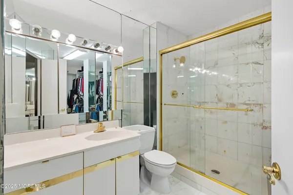 a living room with furniture a ceiling fan and a rug