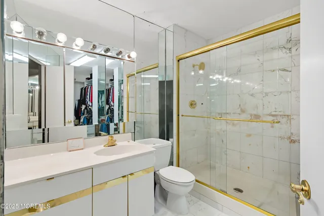 a living room with furniture a ceiling fan and a rug