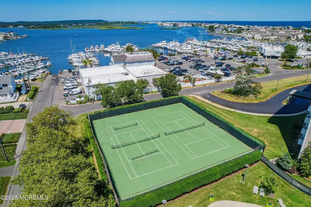 a view of a backyard with swimming pool and outdoor seating