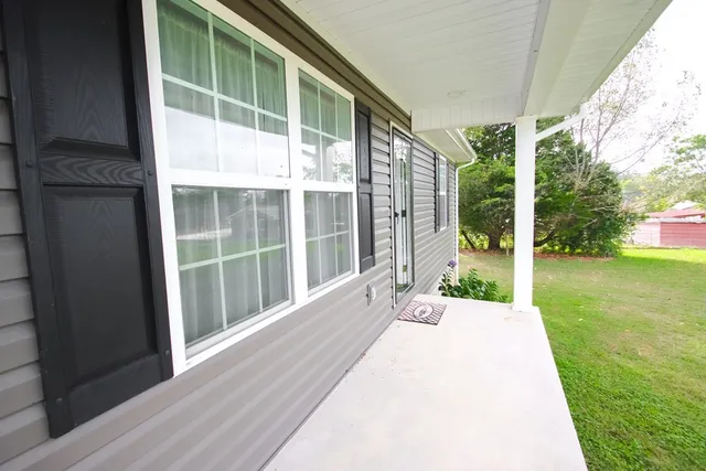 a view of kitchen with sink microwave and stove