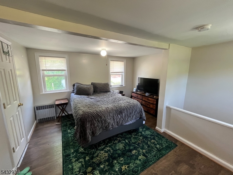 9 New Row Road, Unit A Hibernia, NJ 07842 - Photo 13 of 18 a bedroom with a bed and a flat screen tv