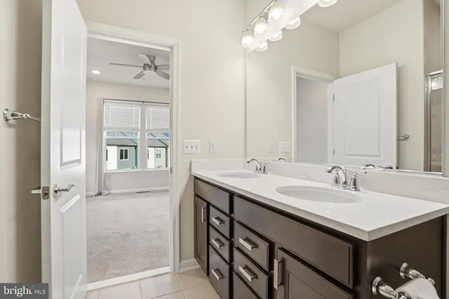 a bathroom with a sink double vanity and a mirror