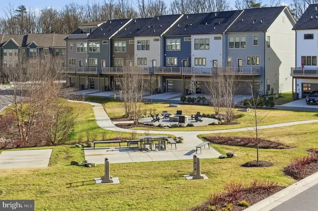 a view of a swimming pool with an outdoor seating