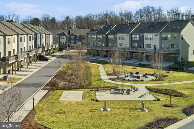 a swimming pool view with a outdoor seating
