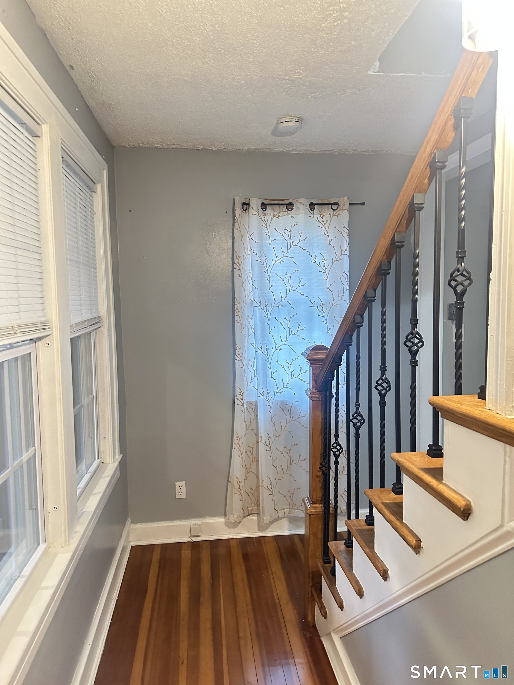 83 Faneuil Street Windsor, CT 06095 - Photo 4 of 14 a view of front door with wooden floor and door
