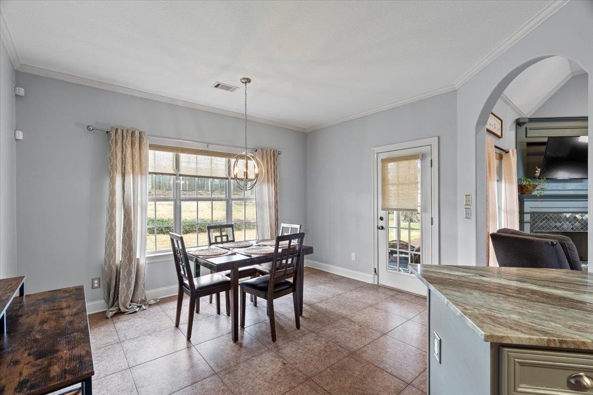 4740 Wellsgate Point Bartlett, TN 38135 - Photo 11 of 36 a view of a dining room with furniture window and outside view