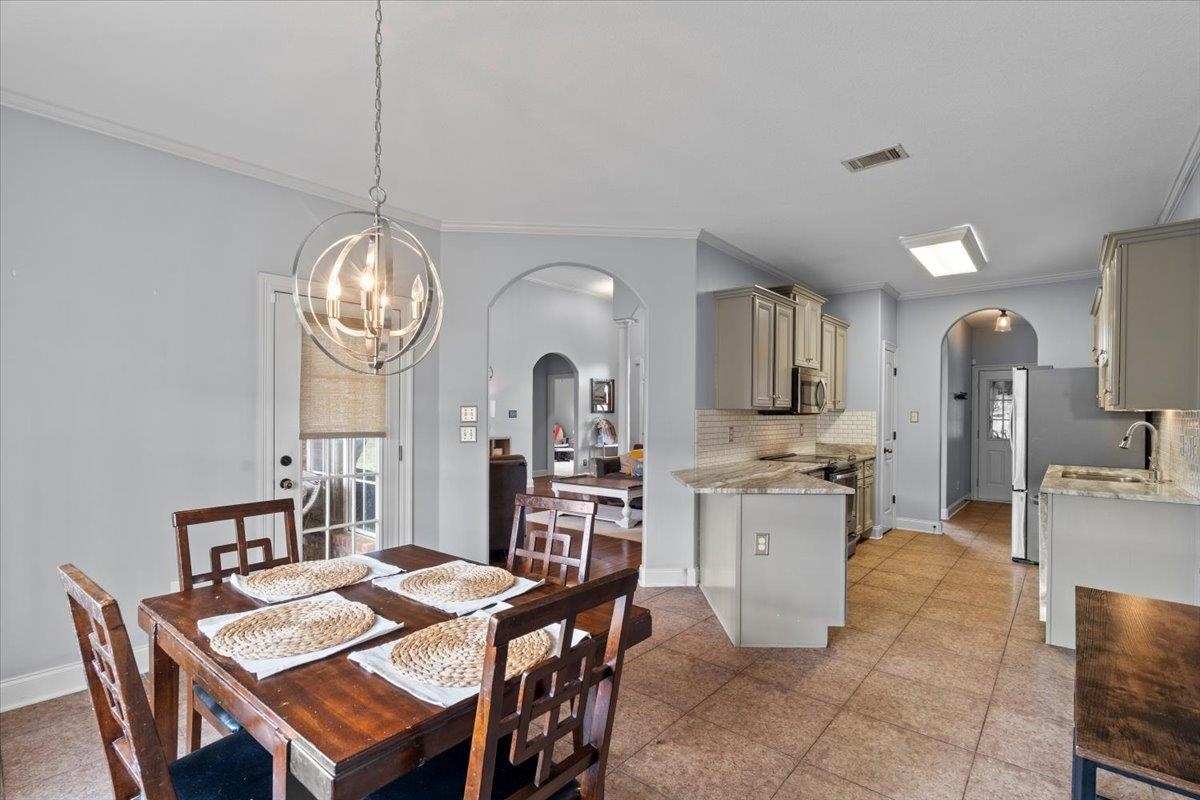 4740 Wellsgate Point Bartlett, TN 38135 - Photo 12 of 36 a view of a dining room and kitchen