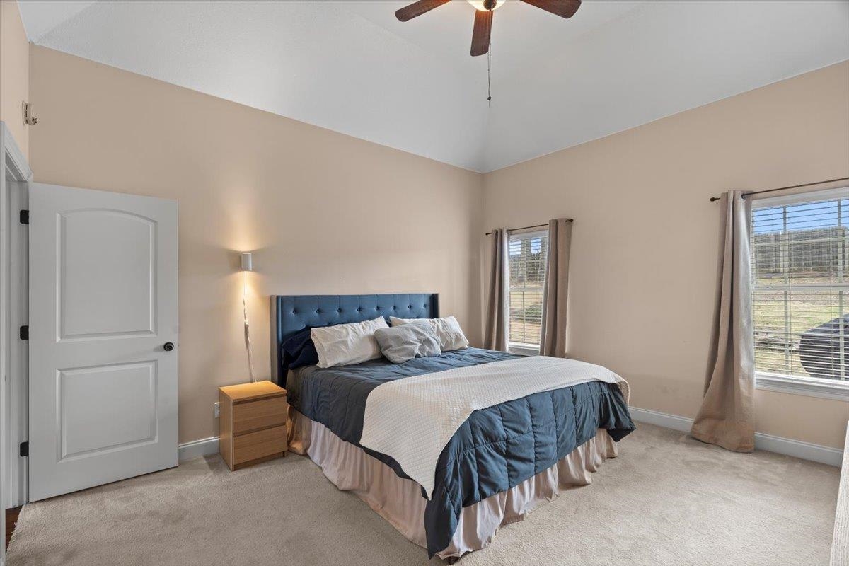 4740 Wellsgate Point Bartlett, TN 38135 - Photo 13 of 36 a bedroom with a bed and a chandelier