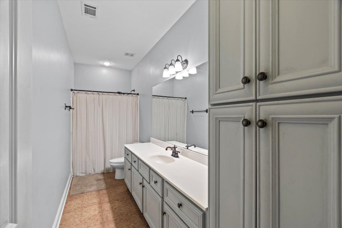 4740 Wellsgate Point Bartlett, TN 38135 - Photo 21 of 36 a spacious bathroom with a double vanity sink a mirror and shower