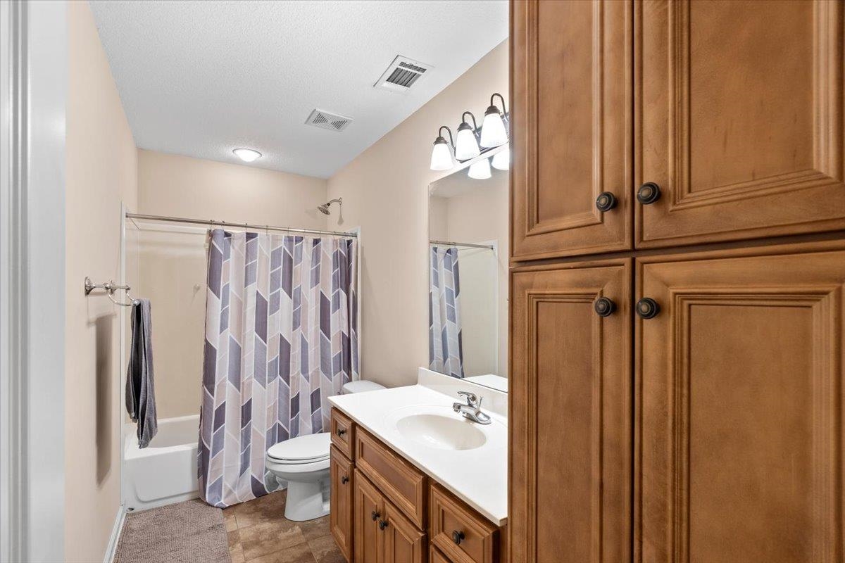 4740 Wellsgate Point Bartlett, TN 38135 - Photo 24 of 36 a bathroom with a sink a toilet and shower