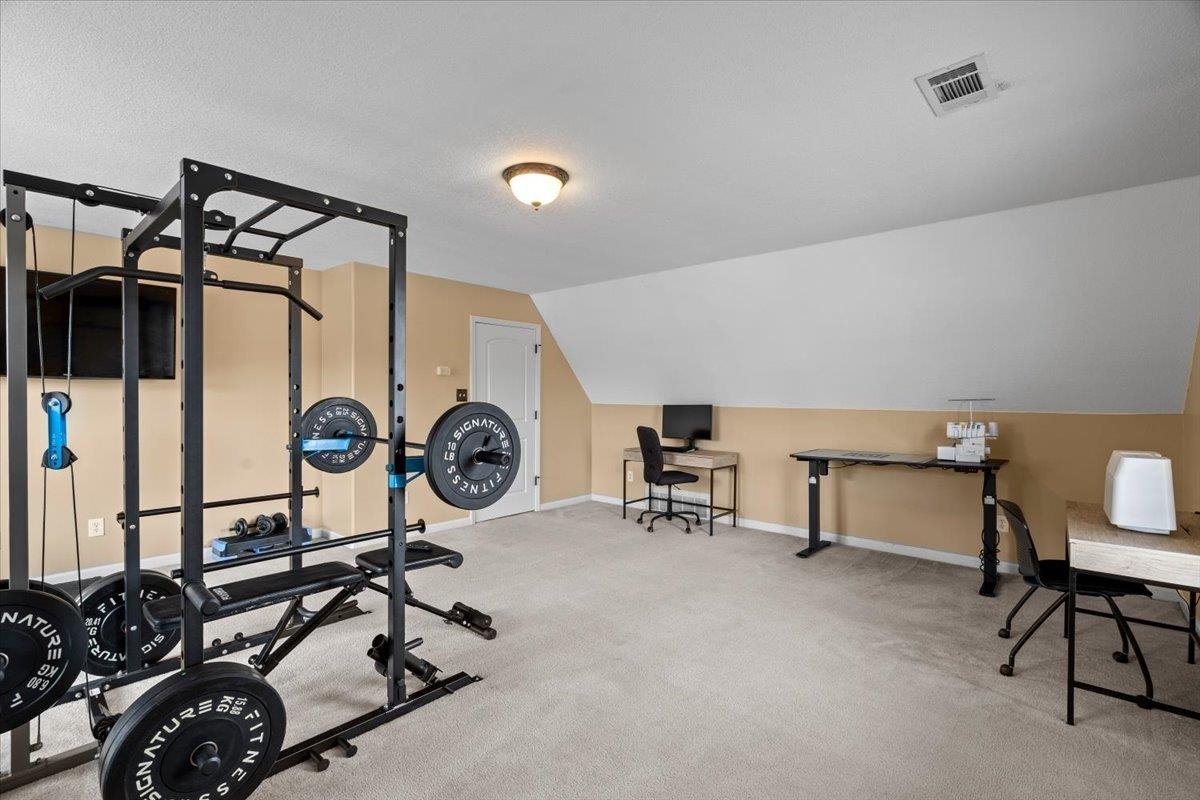 4740 Wellsgate Point Bartlett, TN 38135 - Photo 26 of 36 a view of a room with gym equipment