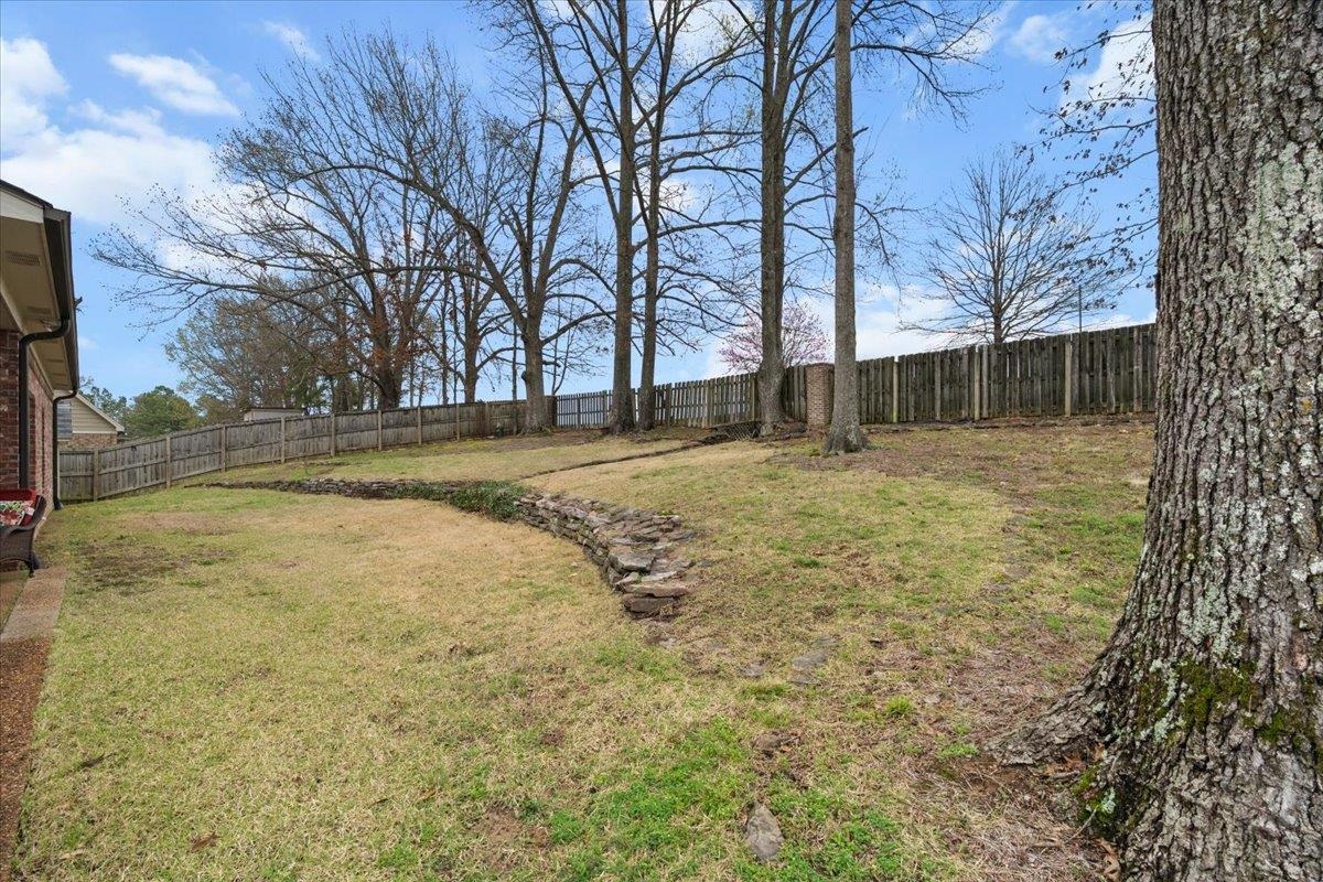 4740 Wellsgate Point Bartlett, TN 38135 - Photo 33 of 36 a view of a yard with trees