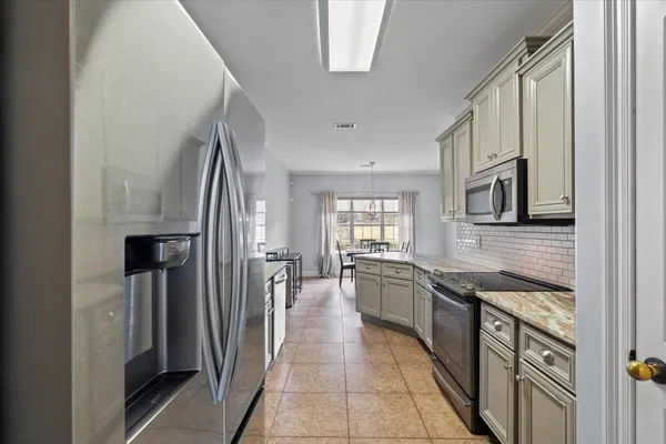 a view of a dining room and kitchen