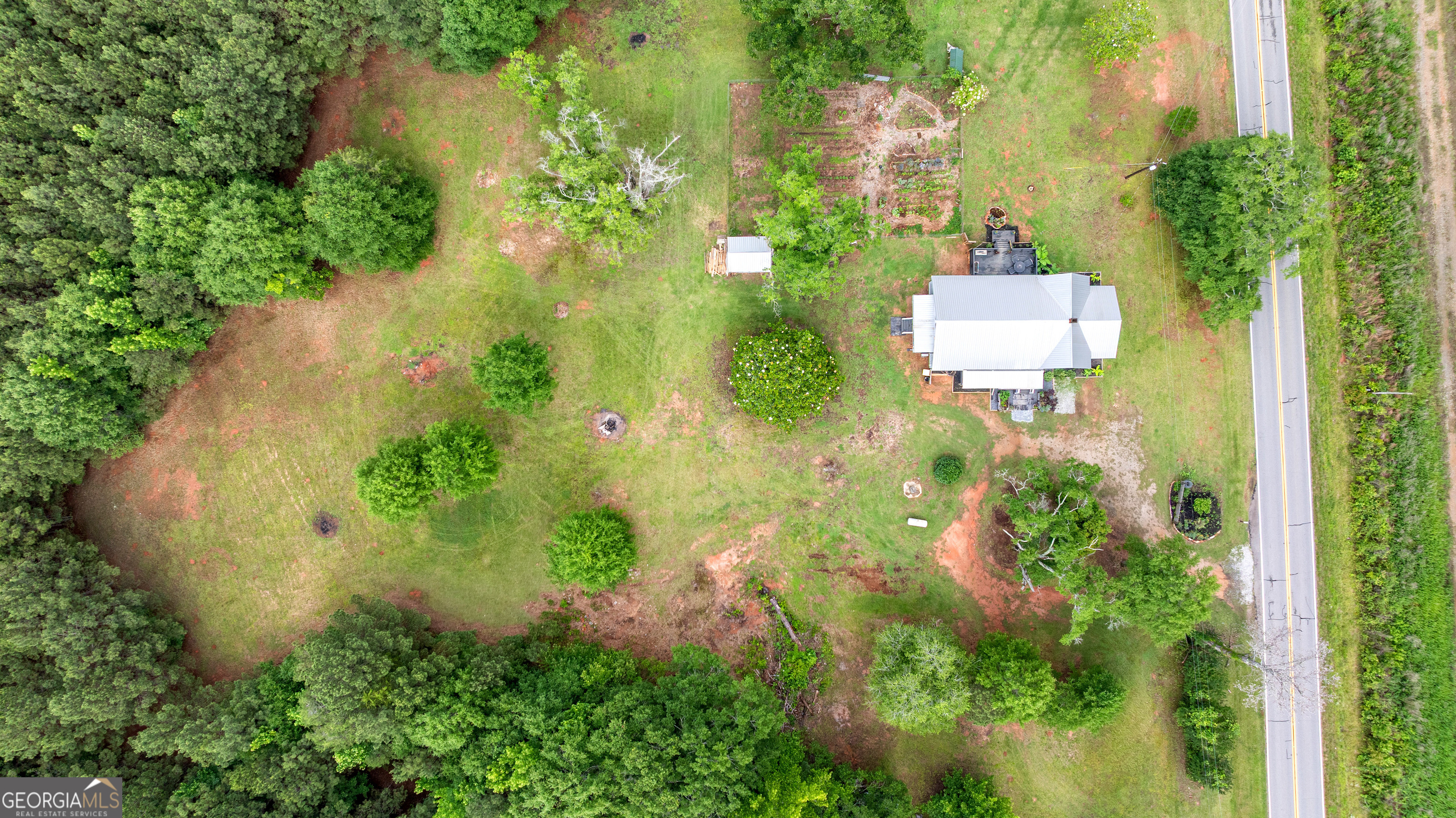 1329 Standing Rock Road Senoia, GA 30276 - Photo 62 of 77 an aerial view of residential house with outdoor space and trees all around