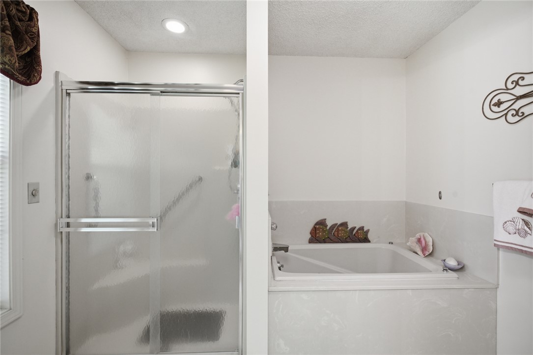6 Tradewinds Way Salem, SC 29676 - Photo 11 of 50 This bathroom features a functional shower and a relaxing tub, creating a versatile and inviting space.