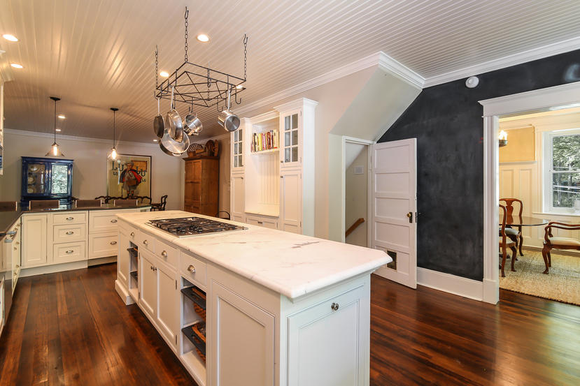 17 Goodwives River Road Darien, CT 06820 - Photo 12 of 51 a large kitchen with stainless steel appliances a stove a sink dishwasher and a refrigerator with wooden floor