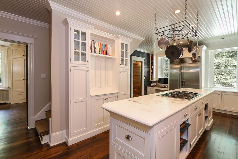17 Goodwives River Road Darien, CT 06820 - Photo 13 of 51 a kitchen that has a stove and a table in it