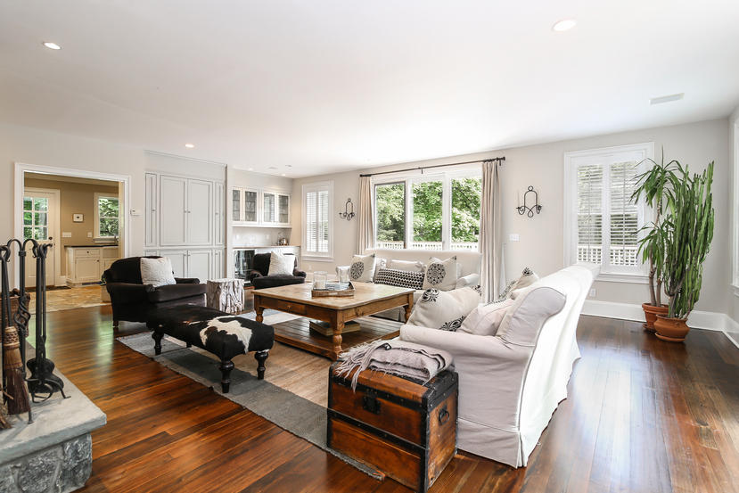 17 Goodwives River Road Darien, CT 06820 - Photo 16 of 51 a living room with furniture floor to ceiling window and wooden floor