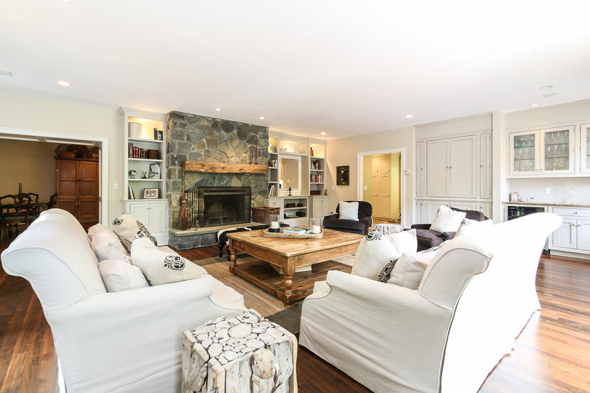 17 Goodwives River Road Darien, CT 06820 - Photo 17 of 51 a living room with furniture fireplace and a fireplace