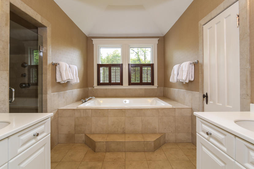 17 Goodwives River Road Darien, CT 06820 - Photo 27 of 51 a spacious bathroom with a tub sink and mirror