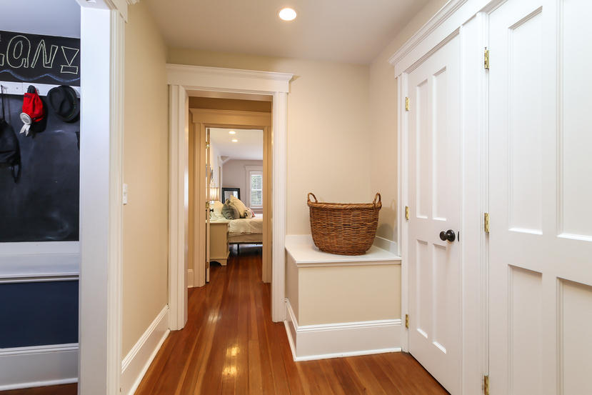 17 Goodwives River Road Darien, CT 06820 - Photo 28 of 51 a view of a hallway and a dining room with wooden floor