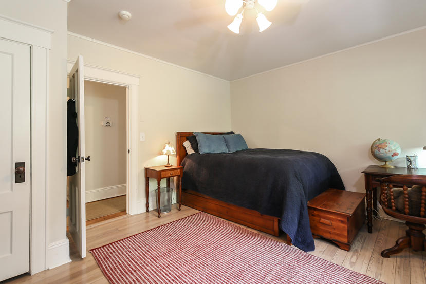 17 Goodwives River Road Darien, CT 06820 - Photo 29 of 51 a bedroom with a bed and chair