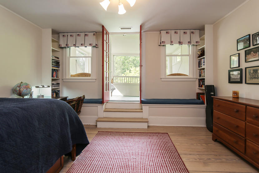 17 Goodwives River Road Darien, CT 06820 - Photo 30 of 51 a spacious bedroom with a bed and a window