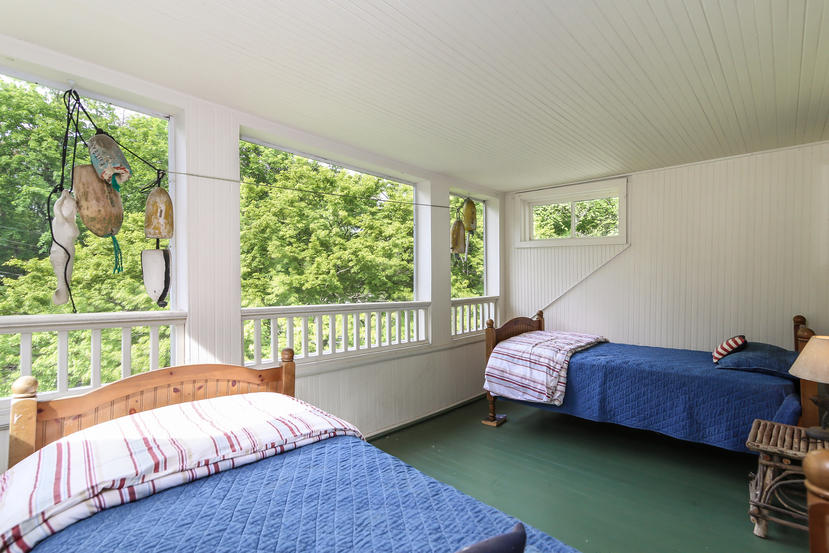 17 Goodwives River Road Darien, CT 06820 - Photo 31 of 51 a bed room with a bed and a chair