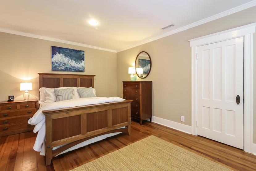 17 Goodwives River Road Darien, CT 06820 - Photo 34 of 51 a bedroom with a bed and wooden floor