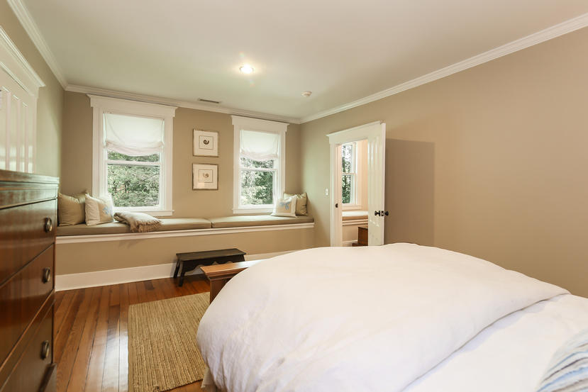 17 Goodwives River Road Darien, CT 06820 - Photo 35 of 51 a spacious bedroom with a large bed and a large window