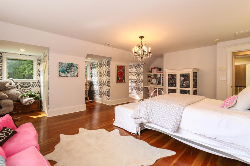 17 Goodwives River Road Darien, CT 06820 - Photo 38 of 51 a spacious bedroom with a bed and wooden floor
