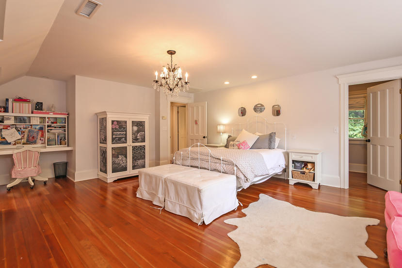 17 Goodwives River Road Darien, CT 06820 - Photo 39 of 51 a bedroom with a bed and wooden floor