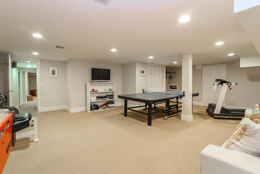 17 Goodwives River Road Darien, CT 06820 - Photo 41 of 51 a room with furniture and a flat screen tv
