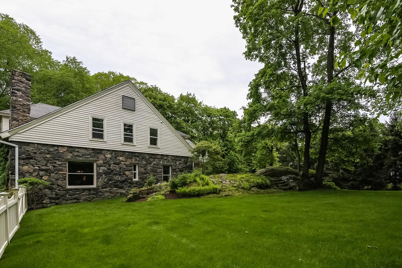 17 Goodwives River Road Darien, CT 06820 - Photo 48 of 51 a front view of house with yard and green space