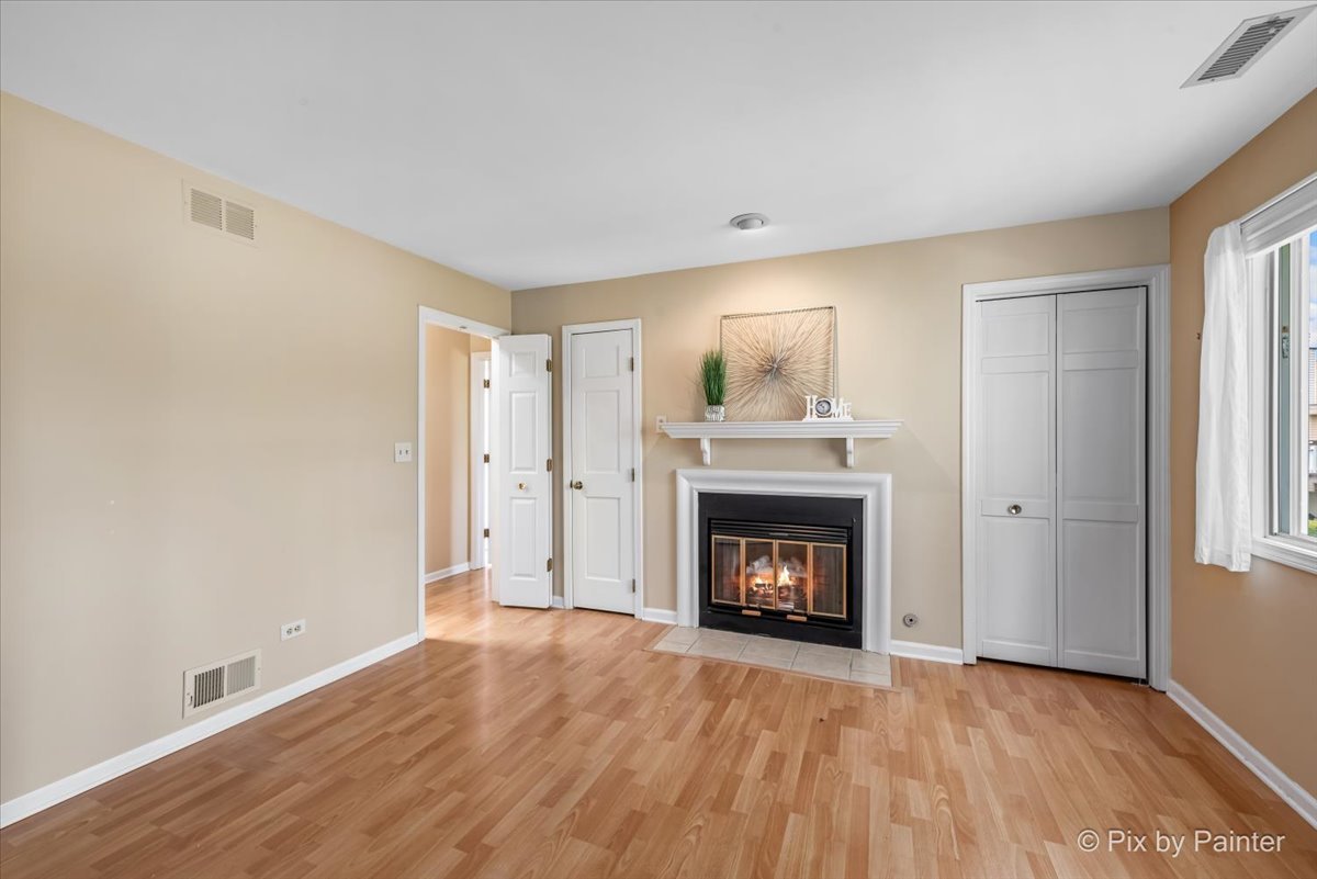 -n021 Windermere Road, Unit 405 Winfield, IL 60190 - Photo 16 of 50 a view of an empty room with a fireplace and a window