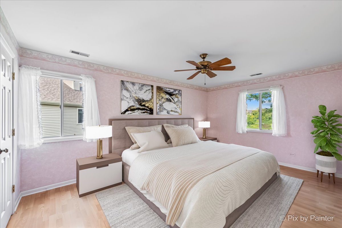 -n021 Windermere Road, Unit 405 Winfield, IL 60190 - Photo 18 of 50 a bedroom with a bed and a chandelier