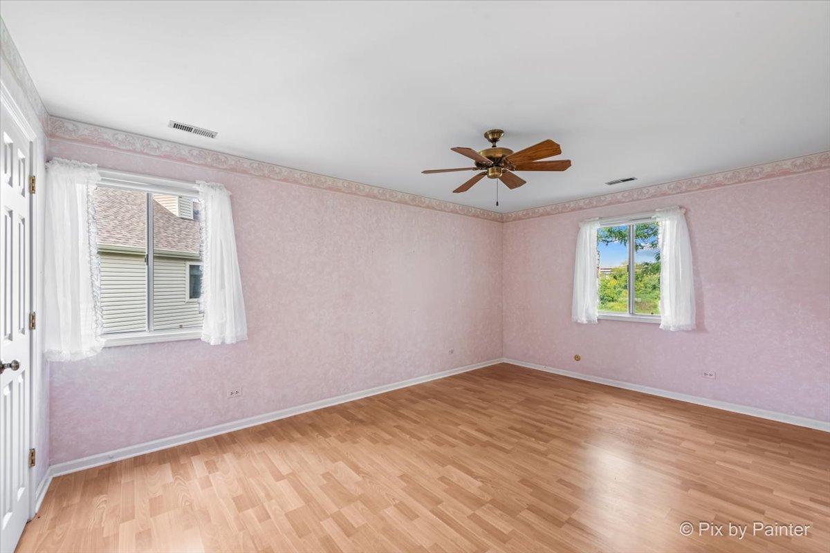 -n021 Windermere Road, Unit 405 Winfield, IL 60190 - Photo 19 of 50 a view of room with window and ceiling fan