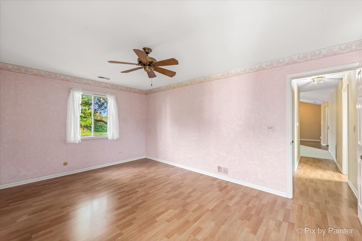 -n021 Windermere Road, Unit 405 Winfield, IL 60190 - Photo 20 of 50 wooden floor in an empty room with a window