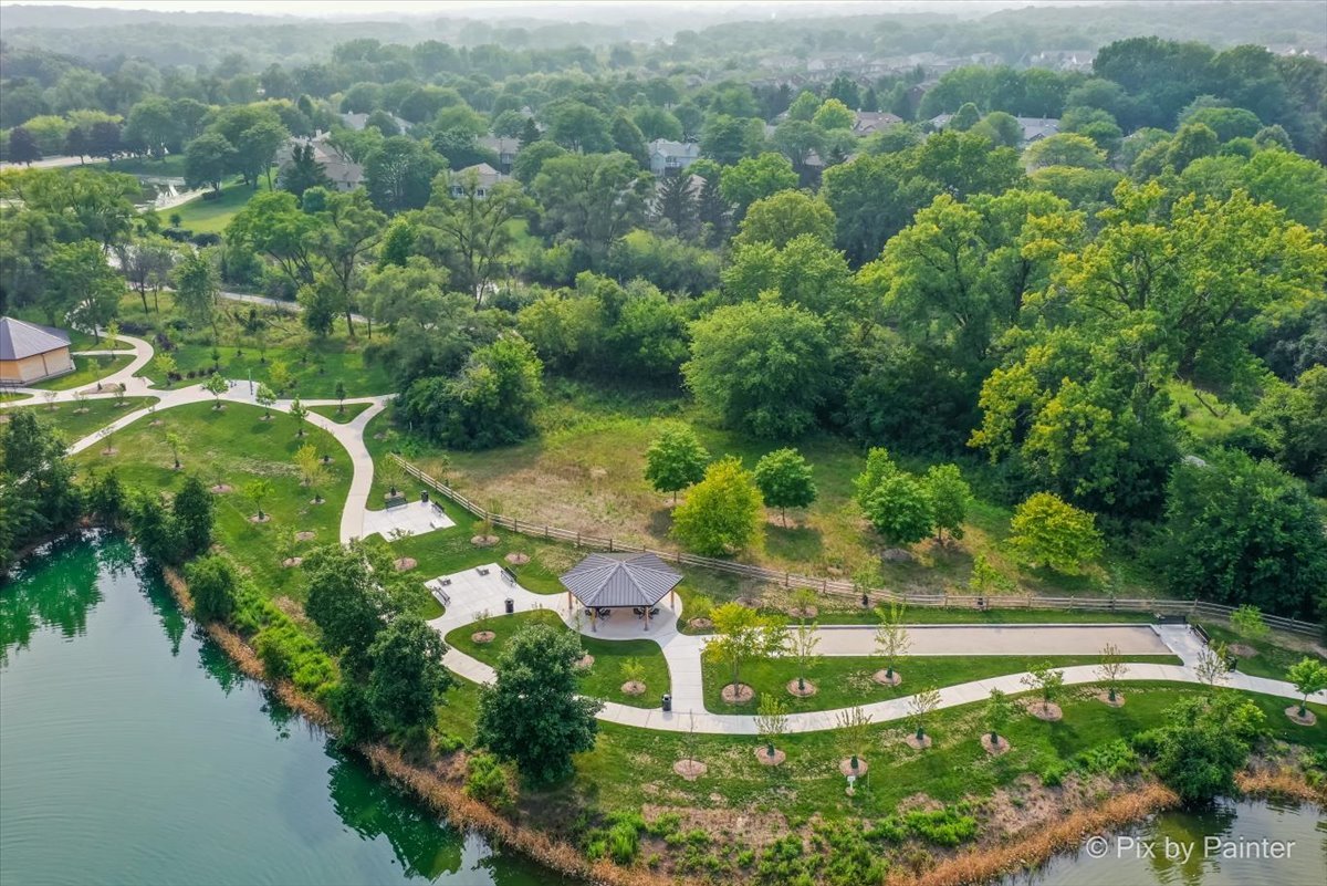 -n021 Windermere Road, Unit 405 Winfield, IL 60190 - Photo 28 of 50 an aerial view of a house with a yard and lake view