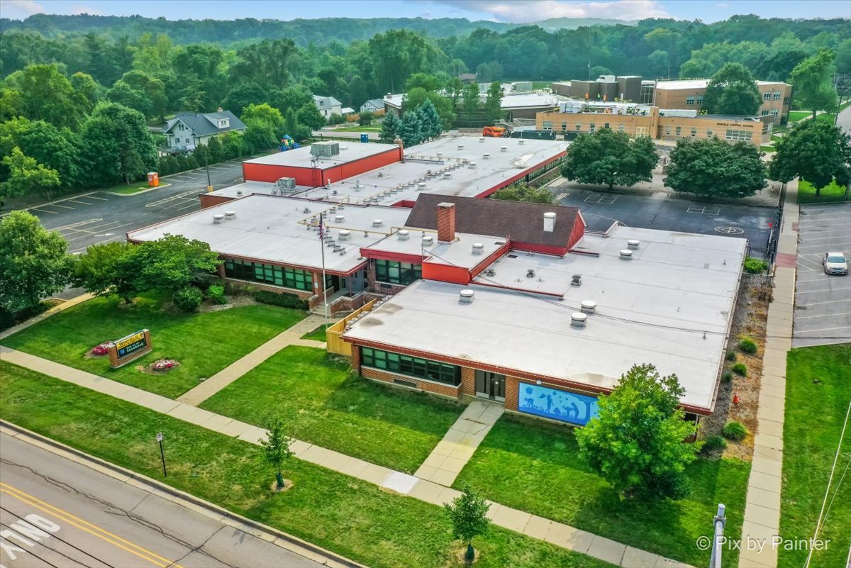 -n021 Windermere Road, Unit 405 Winfield, IL 60190 - Photo 31 of 50 an aerial view of a house with a garden and large trees