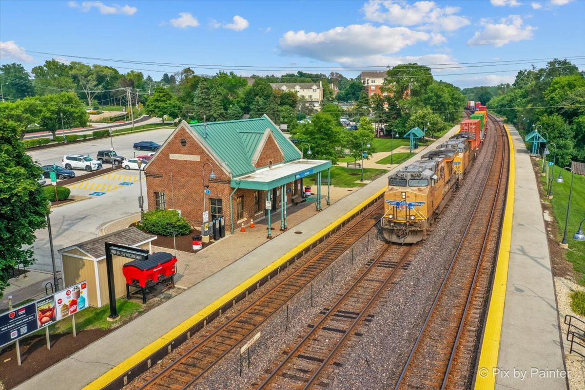 -n021 Windermere Road, Unit 405 Winfield, IL 60190 - Photo 34 of 50 a view of a house with swimming pool and sitting area