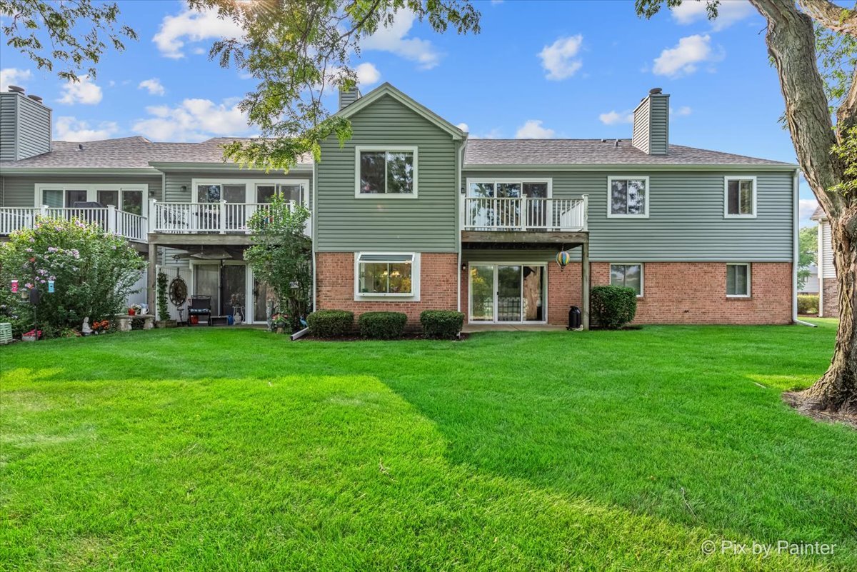 -n021 Windermere Road, Unit 405 Winfield, IL 60190 - Photo 42 of 50 a front view of house with yard and green space