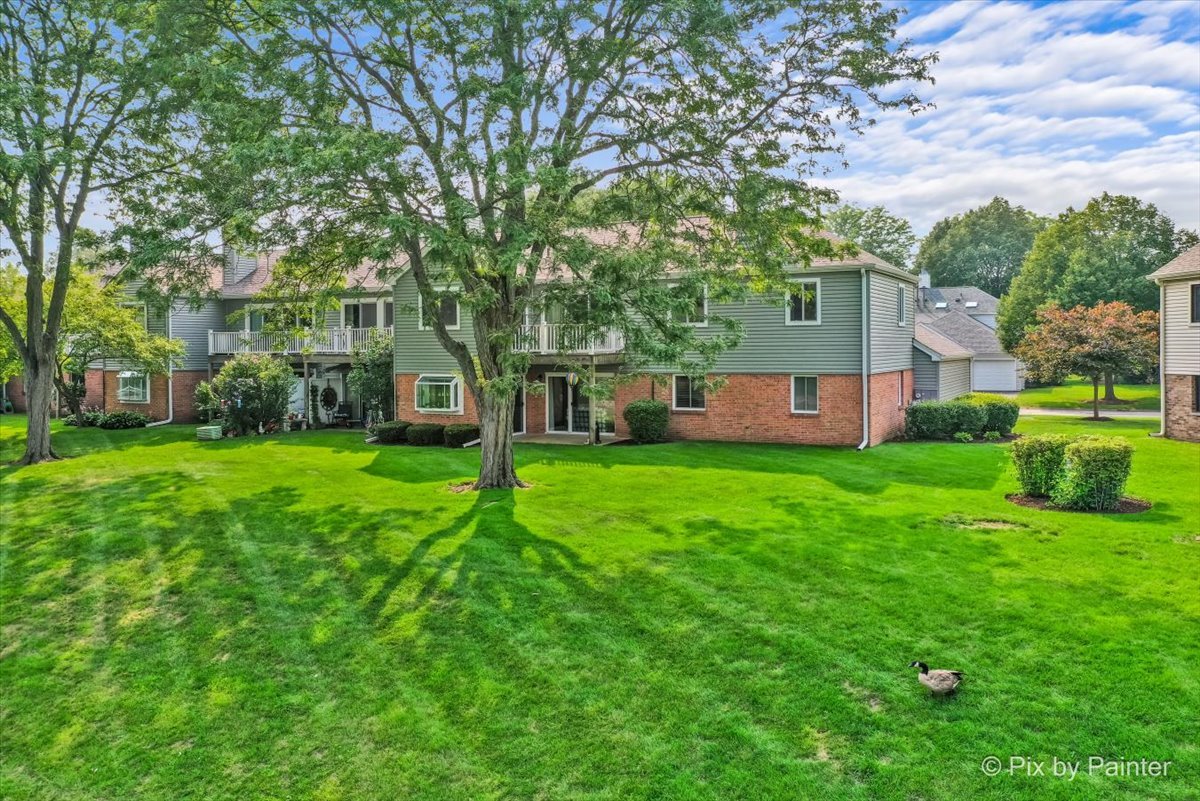 -n021 Windermere Road, Unit 405 Winfield, IL 60190 - Photo 43 of 50 a view of a house with a yard