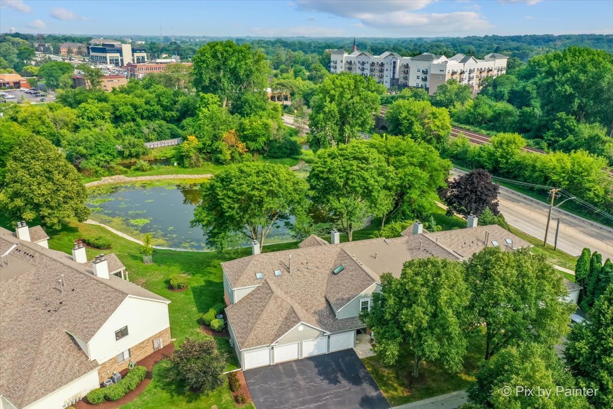 -n021 Windermere Road, Unit 405 Winfield, IL 60190 - Photo 46 of 50 an aerial view of a house with a yard and lake view