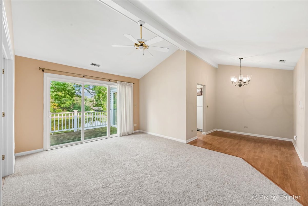 -n021 Windermere Road, Unit 405 Winfield, IL 60190 - Photo 5 of 50 a view of a livingroom with a ceiling fan and window